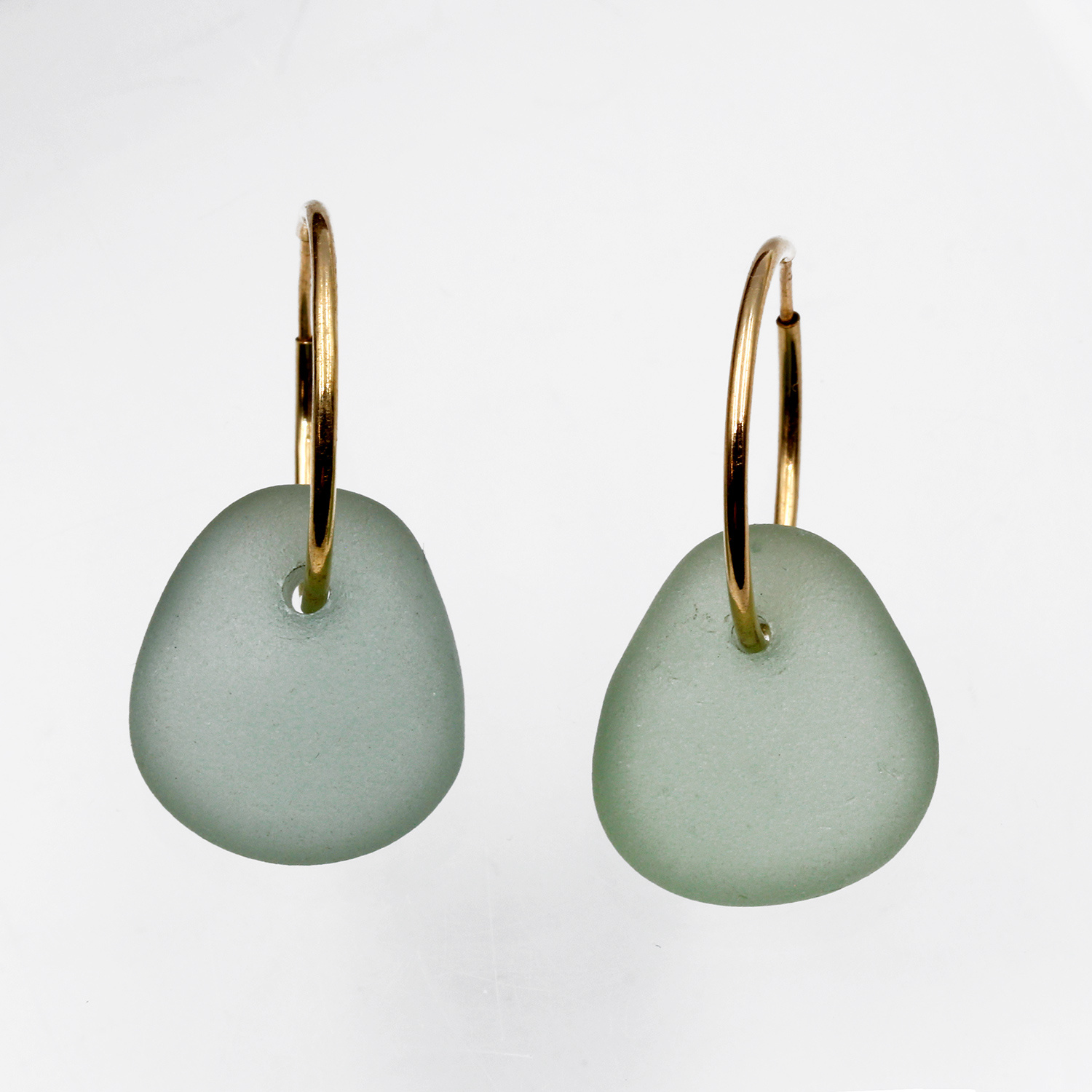 Earrings by Gina Cowen
