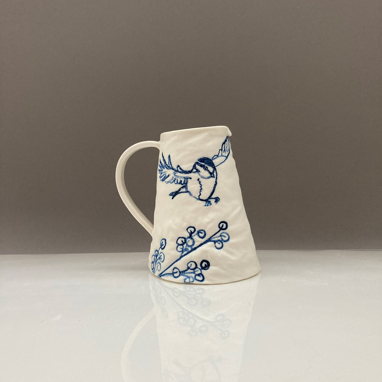 Jug, Blue Tit Landing On Berries by Sarah Grove