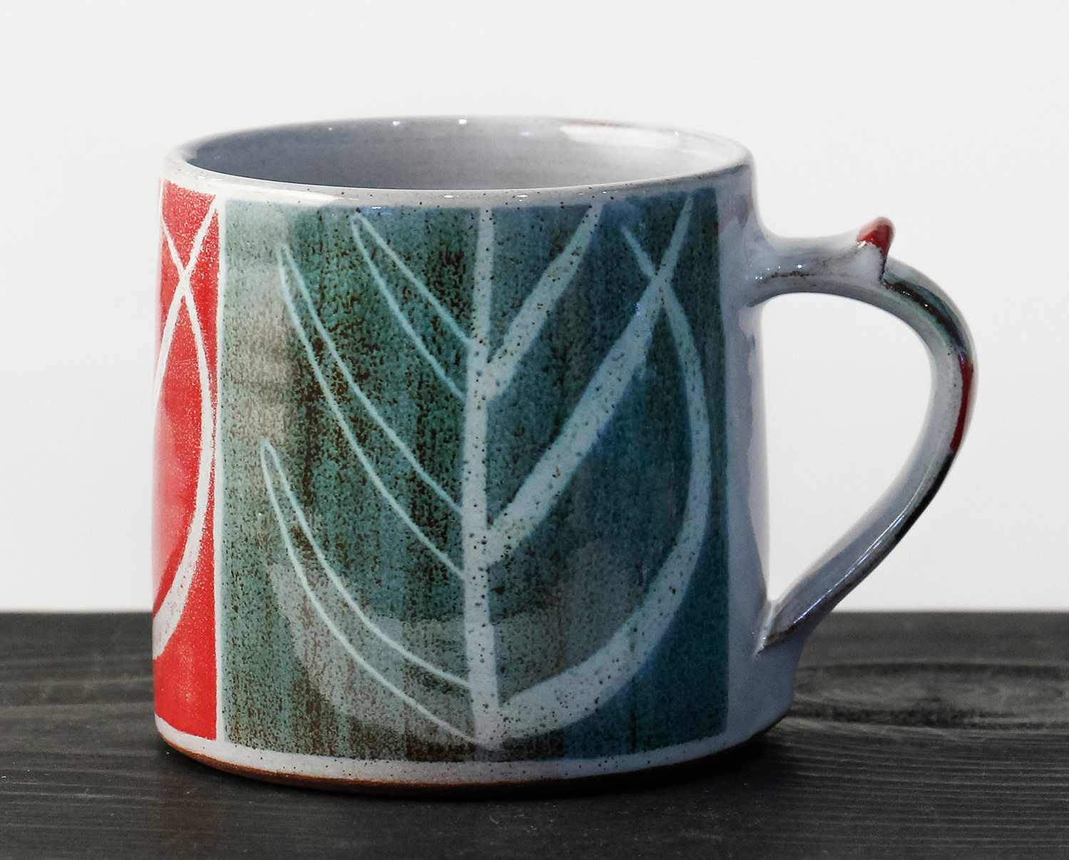 Small Tree Design Mug - dark green and red by Ursula Waechter